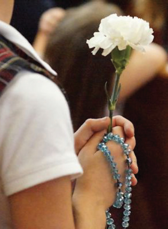 Girl Holding Rosary